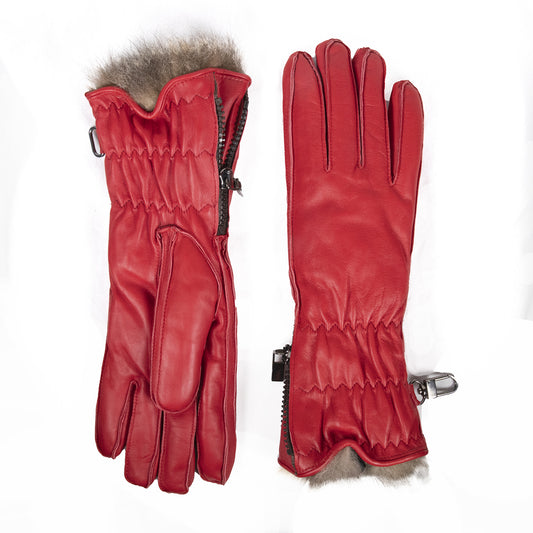 Red leather women's ski gloves featuring a plush fur lining and zippered cuffs for a snug, stylish fit.
