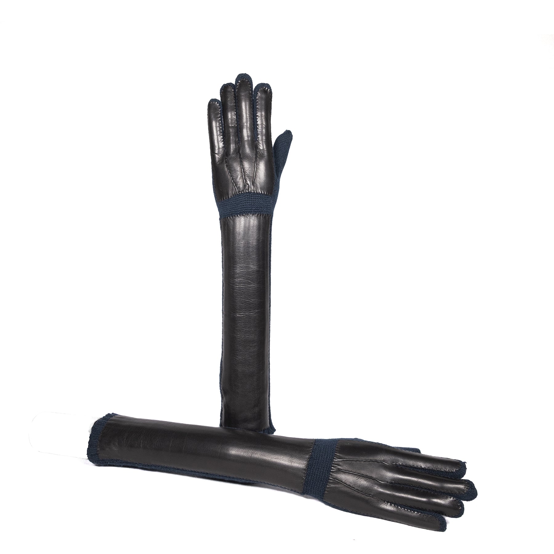Elegant long black cashmere gloves with a contrasting navy cuff, showcasing Italian craftsmanship and luxurious design.