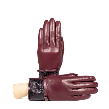 Ladies' burgundy nappa leather gloves with a stylish bow detail and croc-embossed cuff, showcasing Italian craftsmanship.