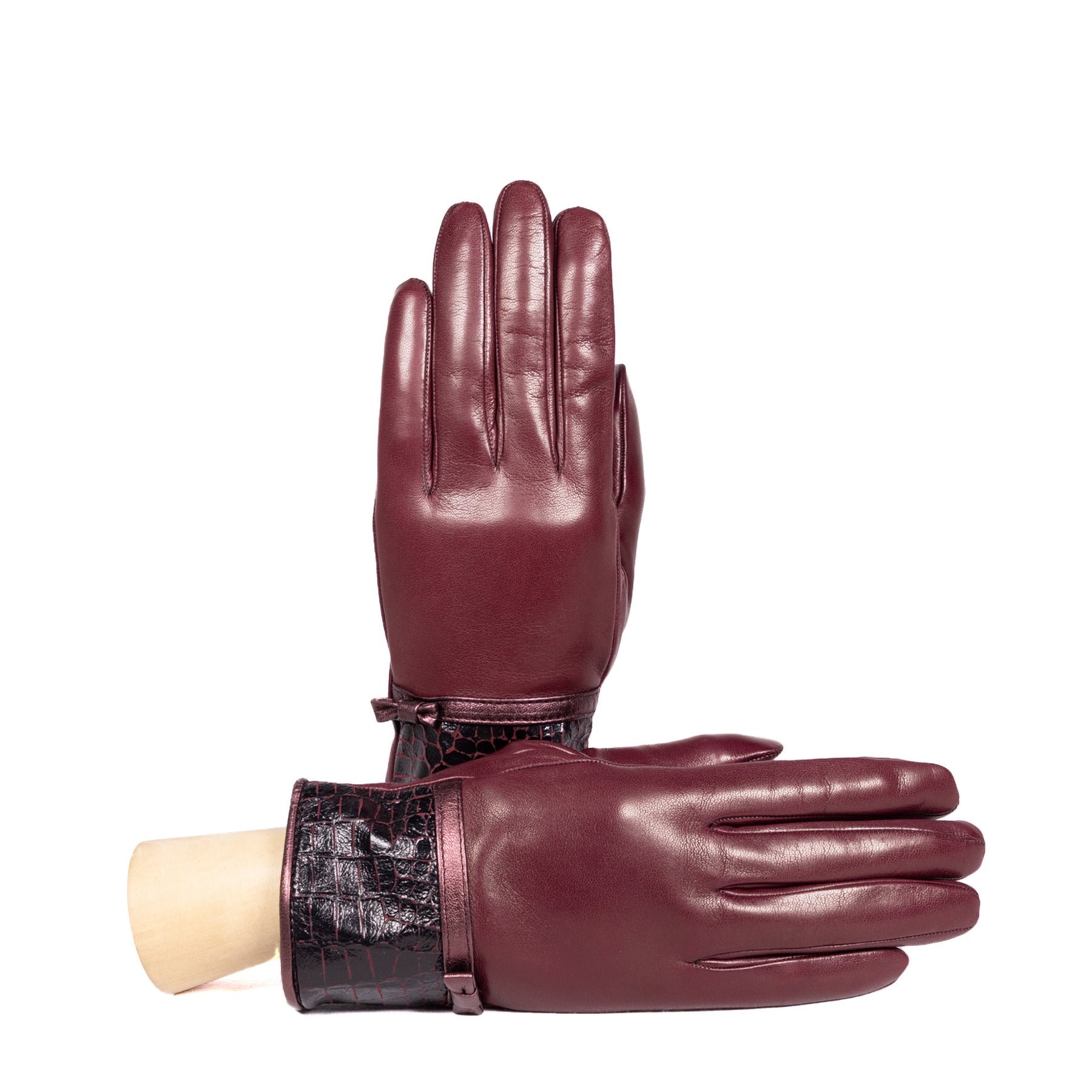 Ladies' burgundy nappa leather gloves with a stylish bow detail and croc-embossed cuff, showcasing Italian craftsmanship.