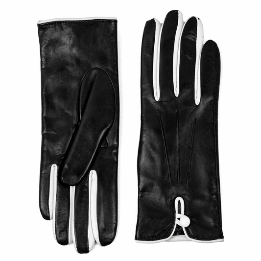 Women's black nappa leather gloves with white detailing and silk lining, showcasing elegant Italian craftsmanship and design.