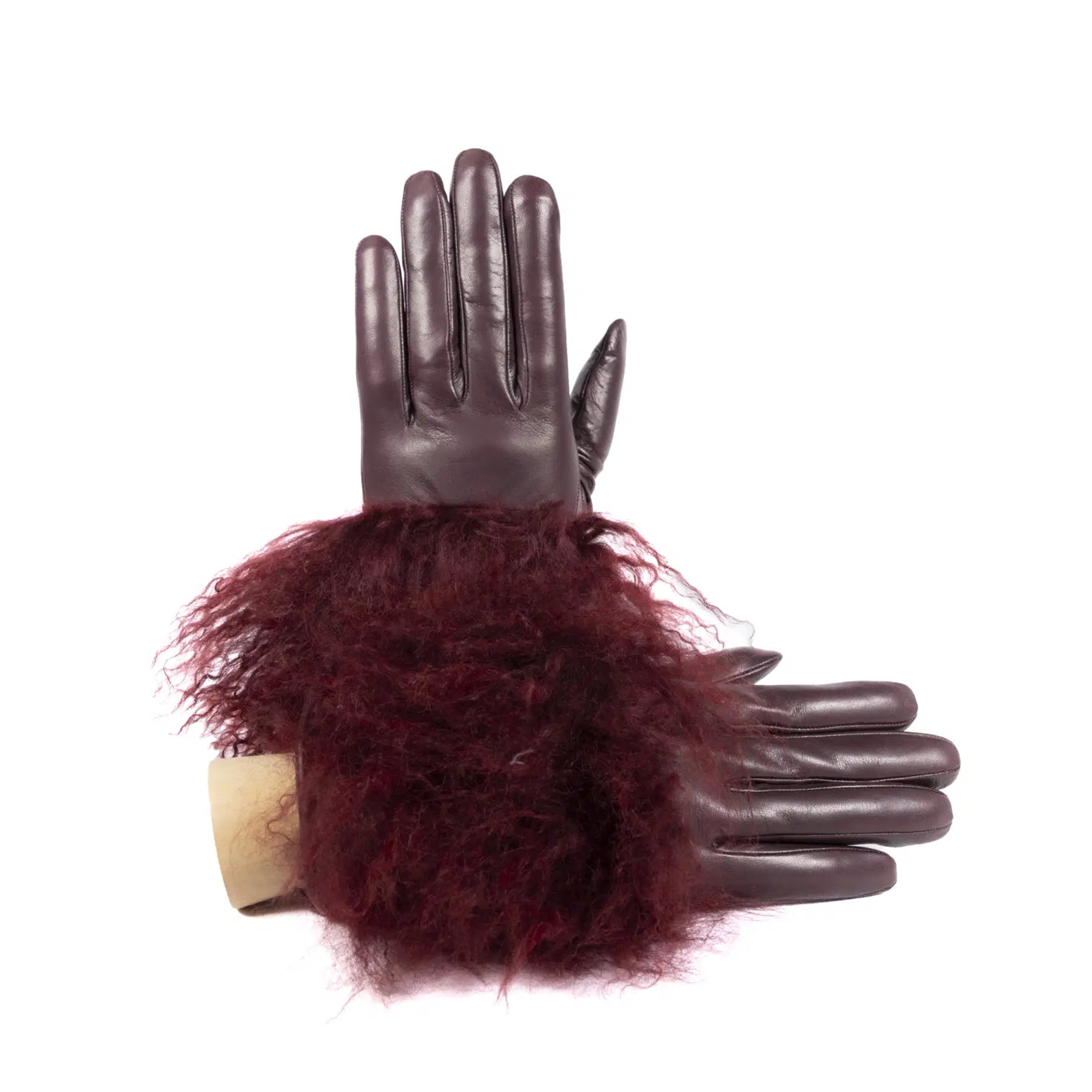 Womens burgundy nappa leather gloves featuring a luxurious pluffy Mongolian fur cuff for added warmth and elegance.