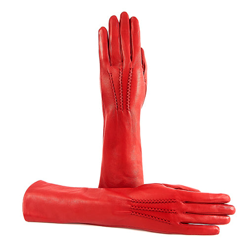 Red nappa leather gloves with elegant stitching detail, showcasing Italian craftsmanship and luxury design.