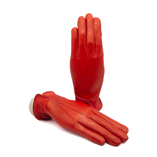 Women's red nappa leather gloves featuring elegant stitching and a soft suede panel, lined with luxurious cashmere for warmth.