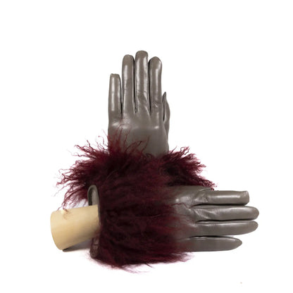 Womens soft nappa leather gloves adorned with plush burgundy Mongolian fur, showcasing elegant Italian craftsmanship.